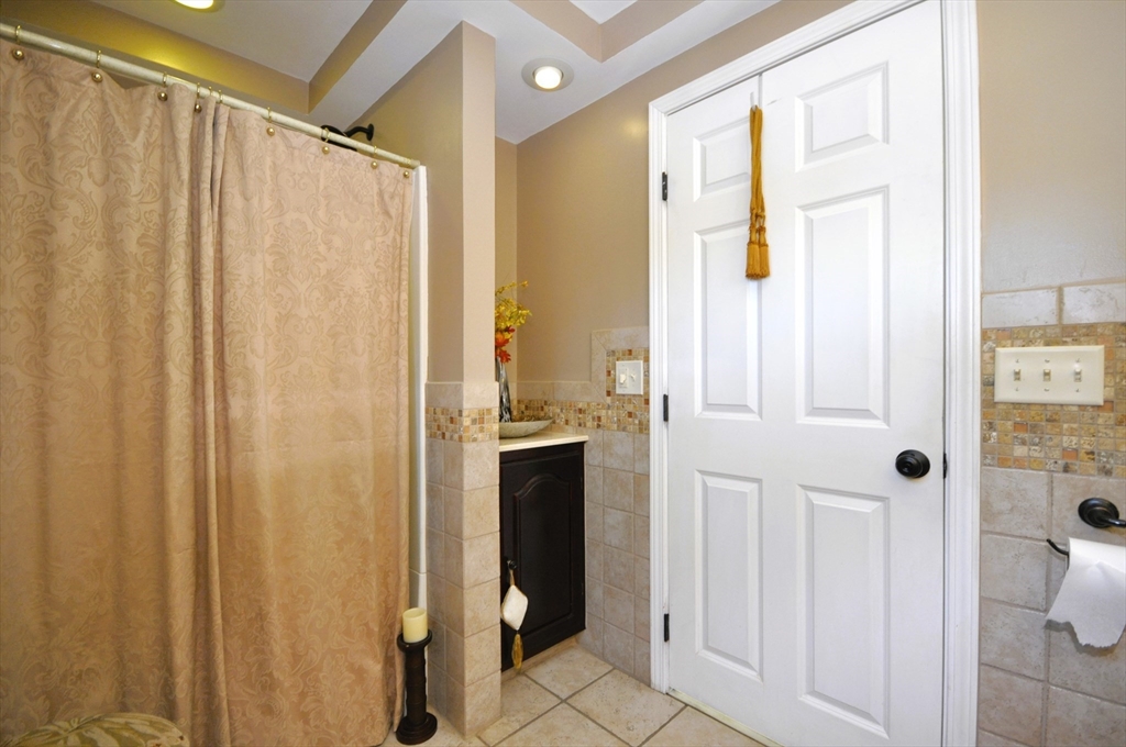 413 Harvard Street Whitman, MA 02382 - Photo 14 of 42 a bathroom with a shower and a sink