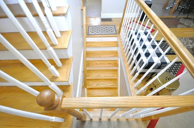 a bathroom with a tub shower and a window