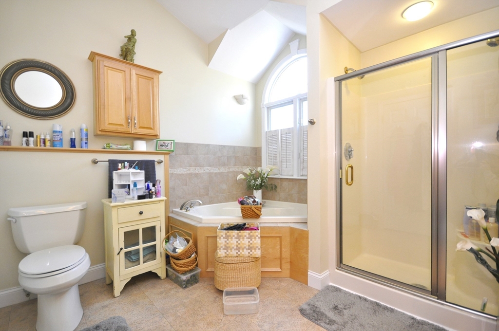 413 Harvard Street Whitman, MA 02382 - Photo 20 of 42 a bathroom with a granite countertop toilet sink and mirror