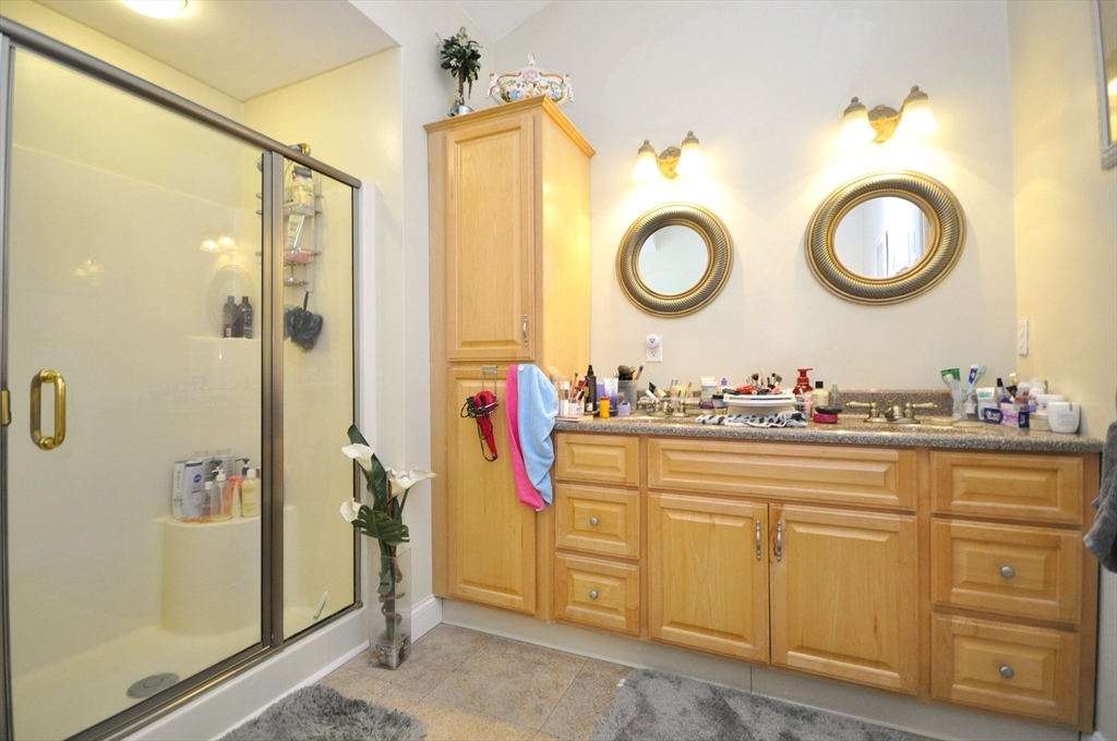 413 Harvard Street Whitman, MA 02382 - Photo 21 of 42 a bathroom with a sink and a mirror