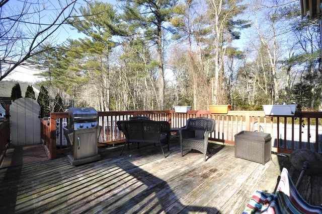 a view of balcony with wooden fence