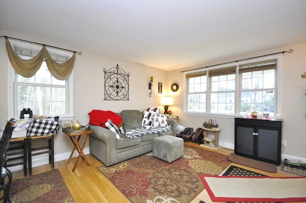 413 Harvard Street Whitman, MA 02382 - Photo 4 of 42 a living room with furniture and a large window