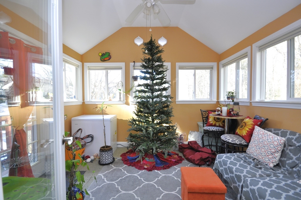 413 Harvard Street Whitman, MA 02382 - Photo 10 of 42 a living room filled with furniture and a chandelier