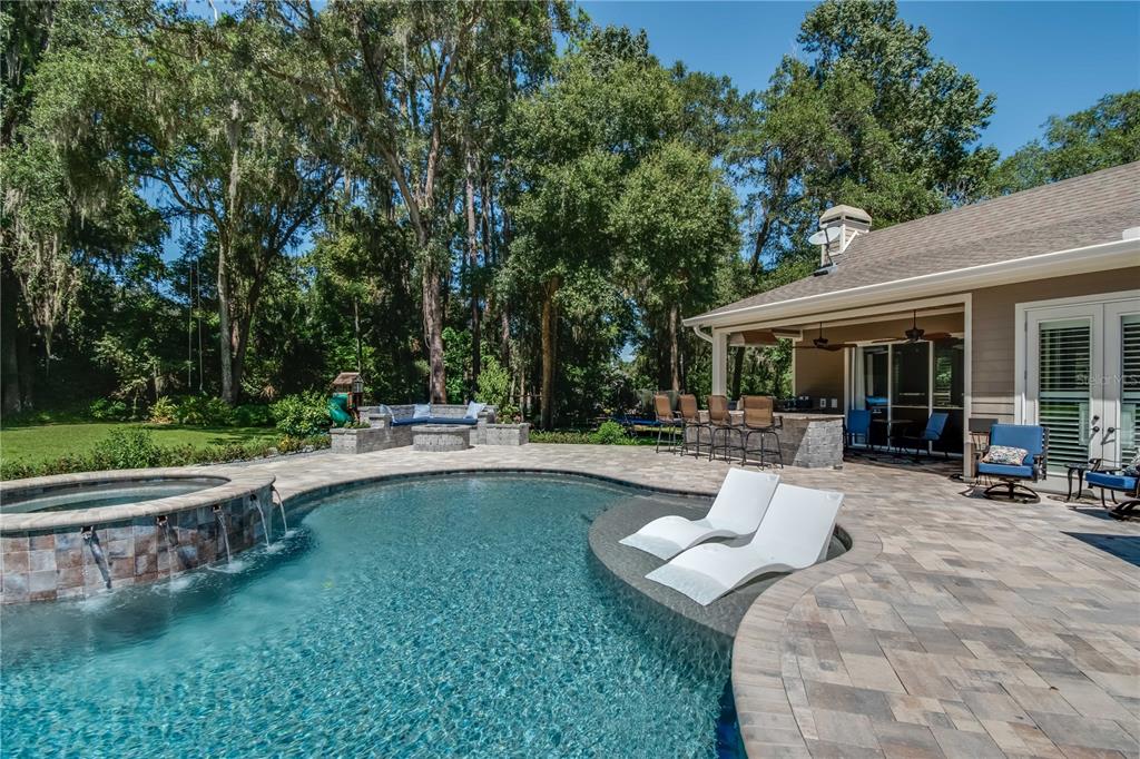 1219 Southwest 63rd Street Road Ocala, FL 34476 - Photo 13 of 72 a view of a house with swimming pool and sitting area