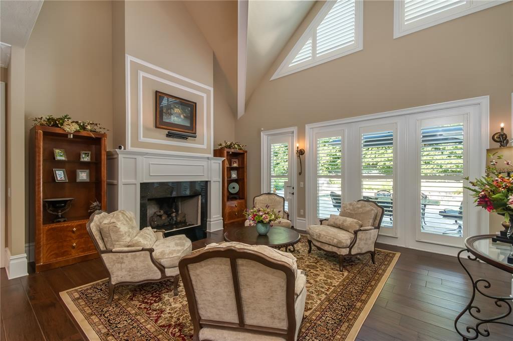 1219 Southwest 63rd Street Road Ocala, FL 34476 - Photo 23 of 72 a living room with furniture and a fireplace