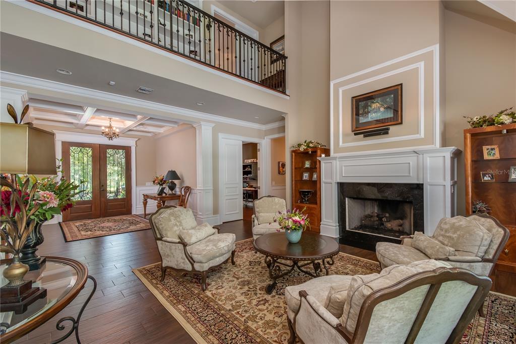 1219 Southwest 63rd Street Road Ocala, FL 34476 - Photo 24 of 72 a living room with furniture fireplace and dining room
