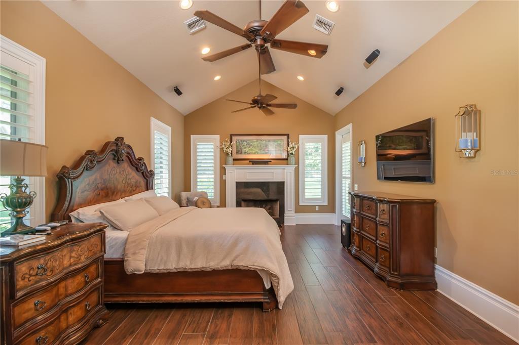 1219 Southwest 63rd Street Road Ocala, FL 34476 - Photo 34 of 72 a bedroom with a bed and a flat screen tv