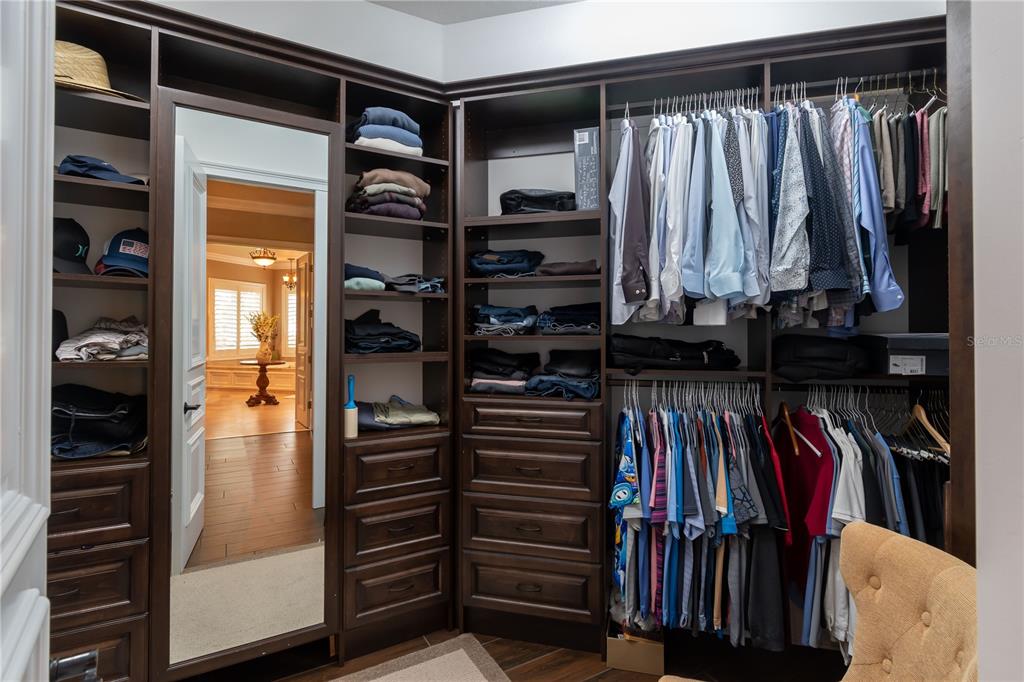 1219 Southwest 63rd Street Road Ocala, FL 34476 - Photo 36 of 72 a view of walk in closet with clothes and shoes