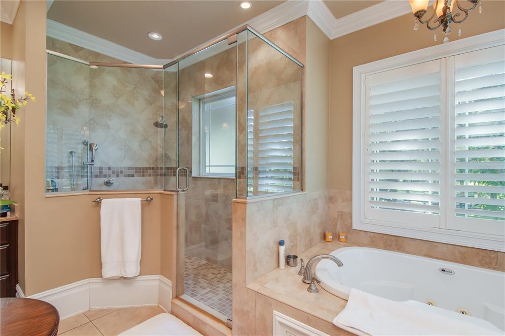 1219 Southwest 63rd Street Road Ocala, FL 34476 - Photo 39 of 72 a bathroom with a granite countertop tub shower and sink