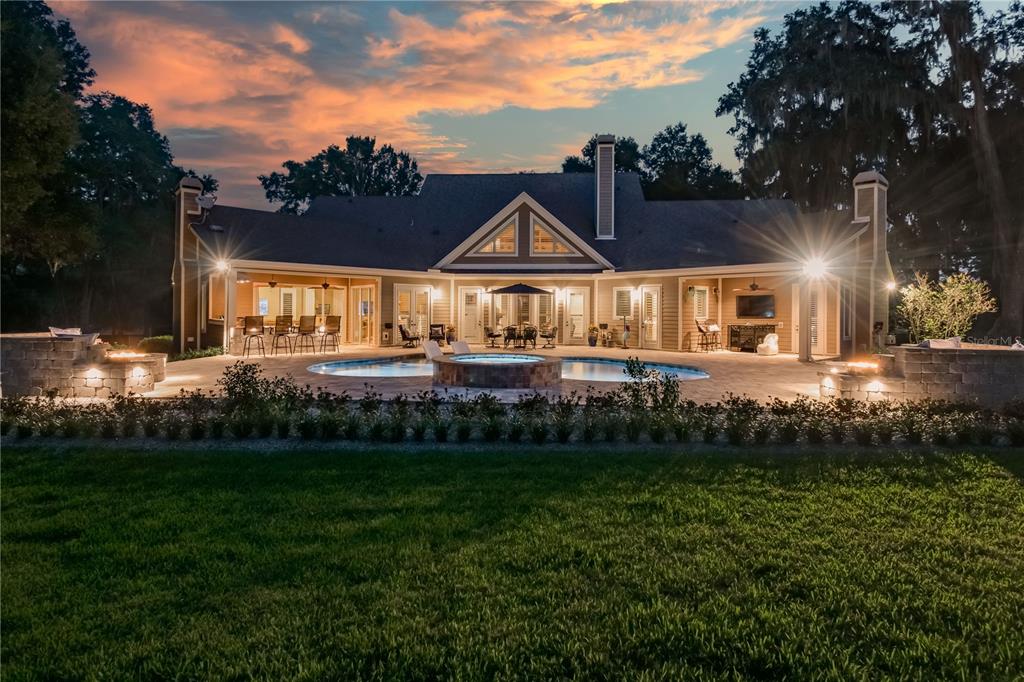 1219 Southwest 63rd Street Road Ocala, FL 34476 - Photo 69 of 72 a front view of a house with a yard