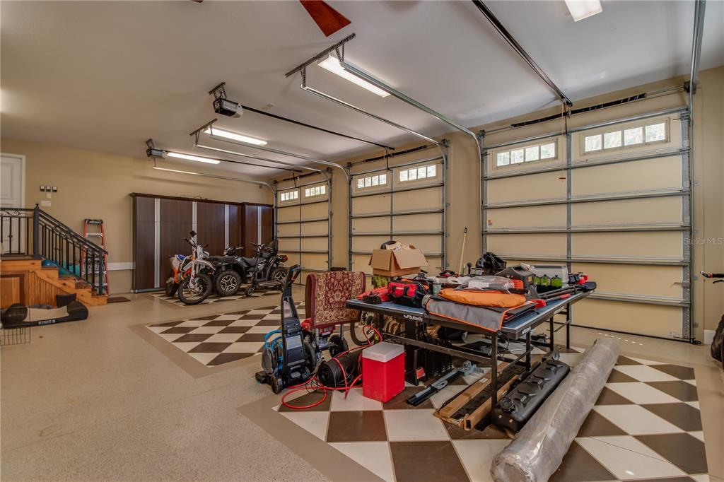 1219 Southwest 63rd Street Road Ocala, FL 34476 - Photo 9 of 72 a view of a garage with a table and chairs