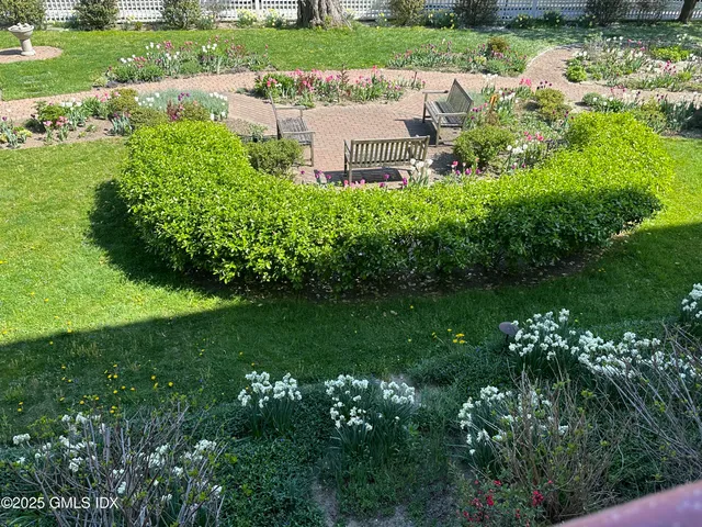 a view of a garden with a fountain