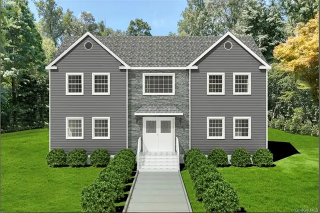 a front view of a house with garden