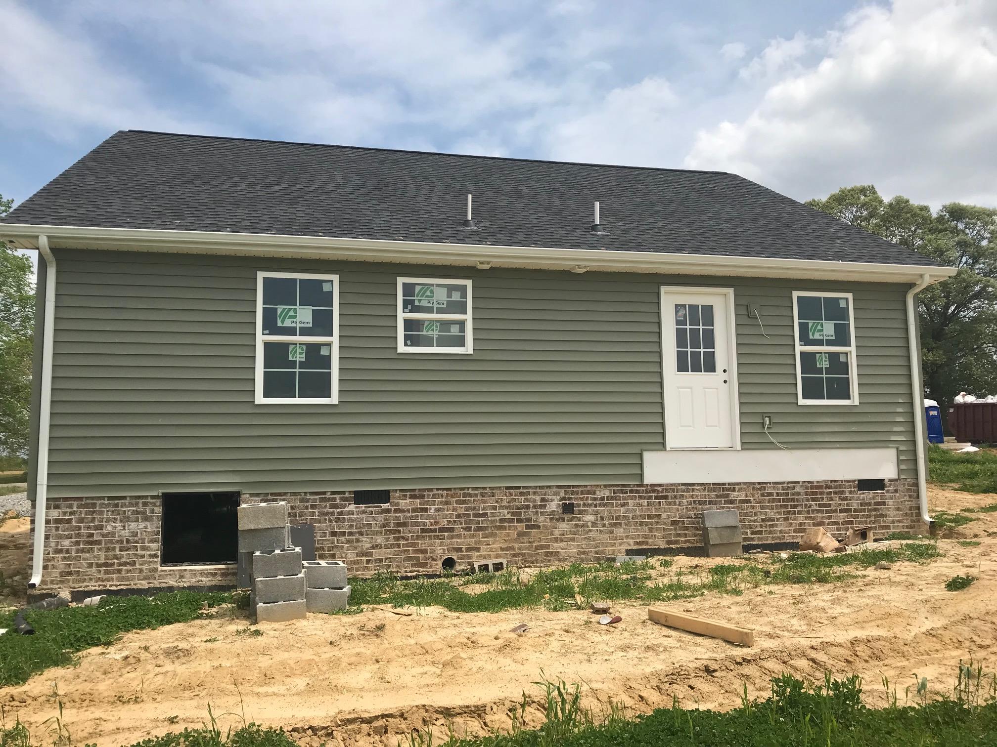 1022 Gil Hodges Road Portland, TN 37148 - Photo 2 of 9 a front view of a house with a yard