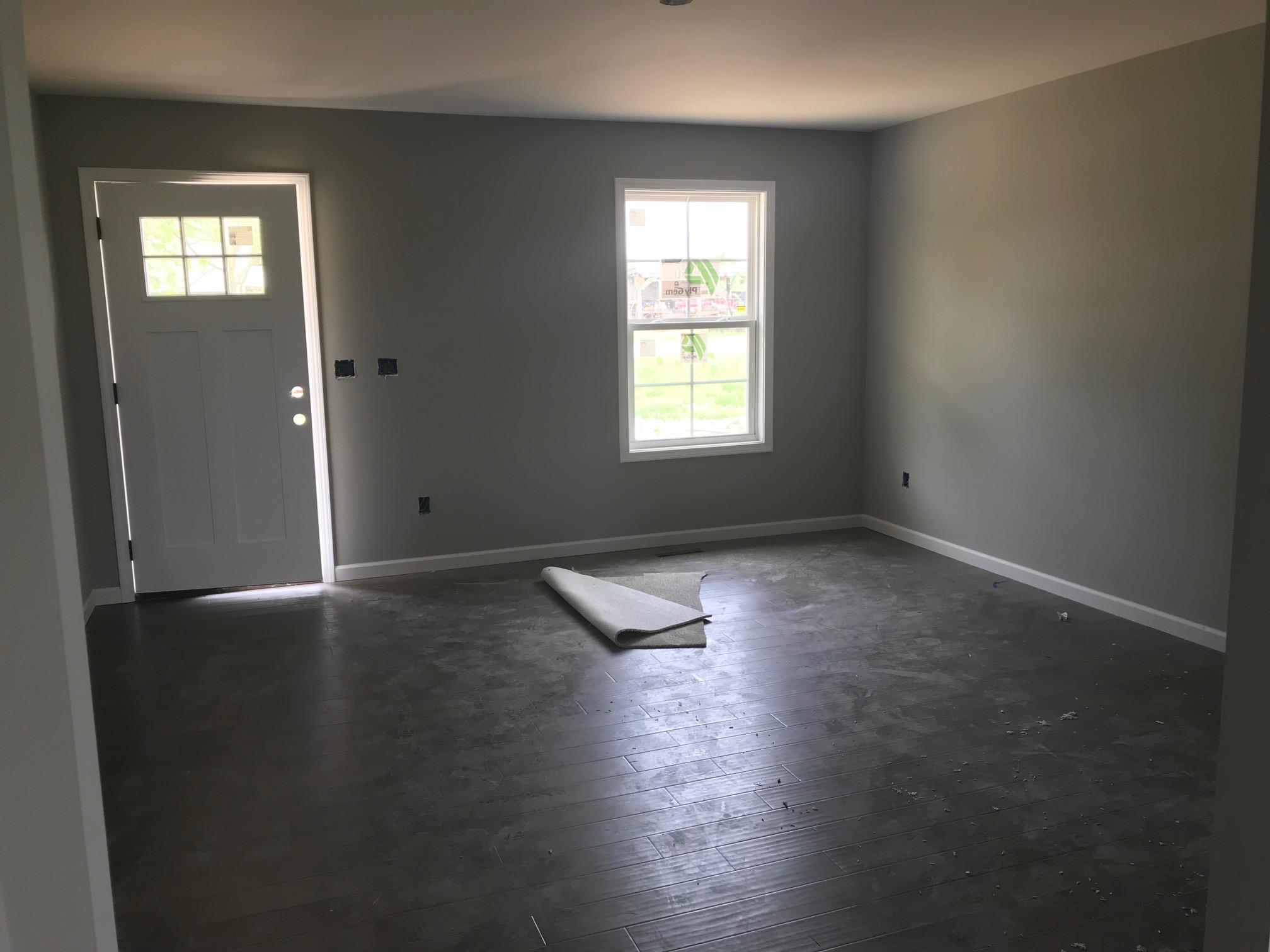 1022 Gil Hodges Road Portland, TN 37148 - Photo 6 of 9 an empty room with wooden floor and windows