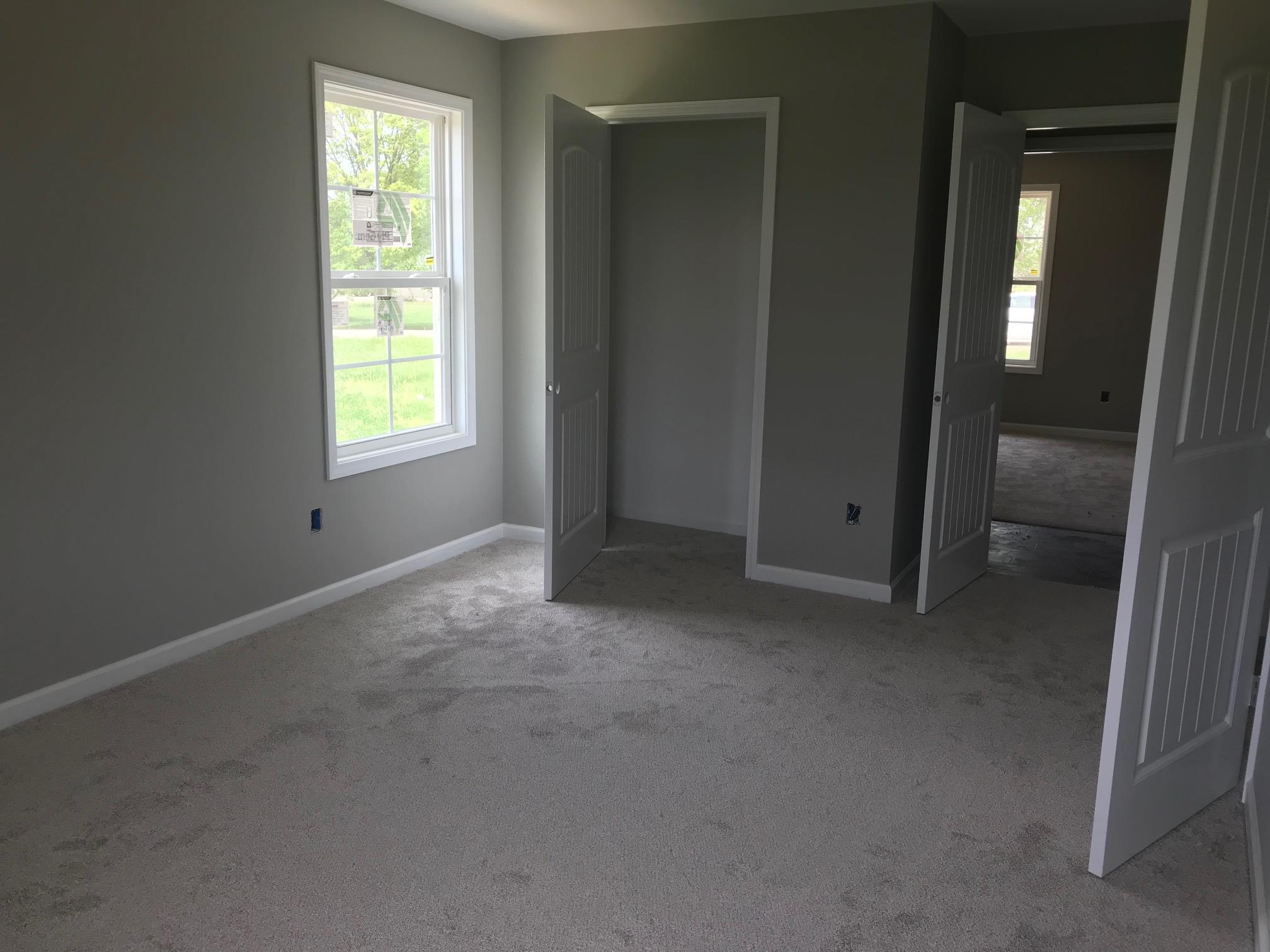 1022 Gil Hodges Road Portland, TN 37148 - Photo 7 of 9 an empty room with windows and closet