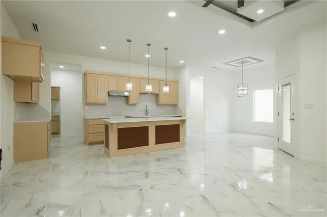 a large bathroom with a large mirror vanity and a shower