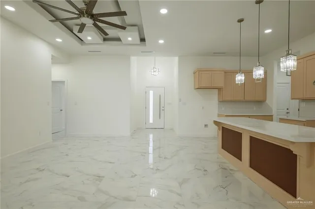 a bathroom with a sink a large mirror and a shower