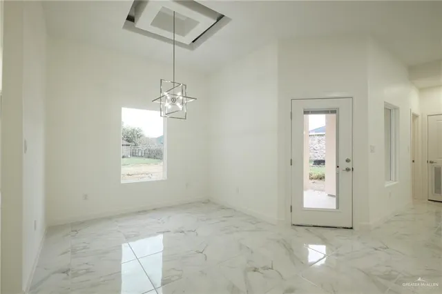 a view of a room with a windows and cabinet
