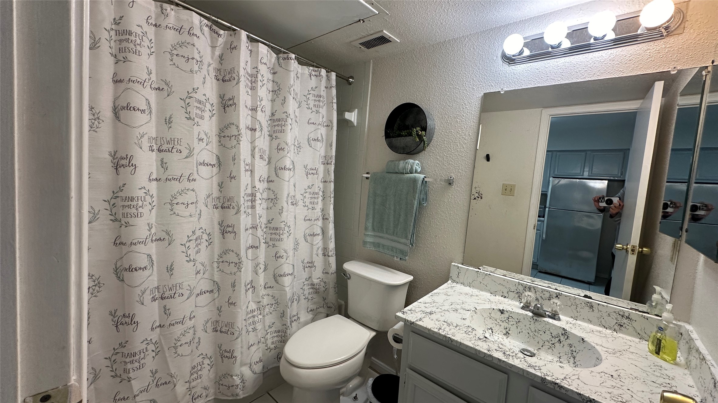 2425 Holly Hall Street, Unit 51C Houston, TX 77054 - Photo 5 of 10 a bathroom with a granite countertop sink toilet and shower