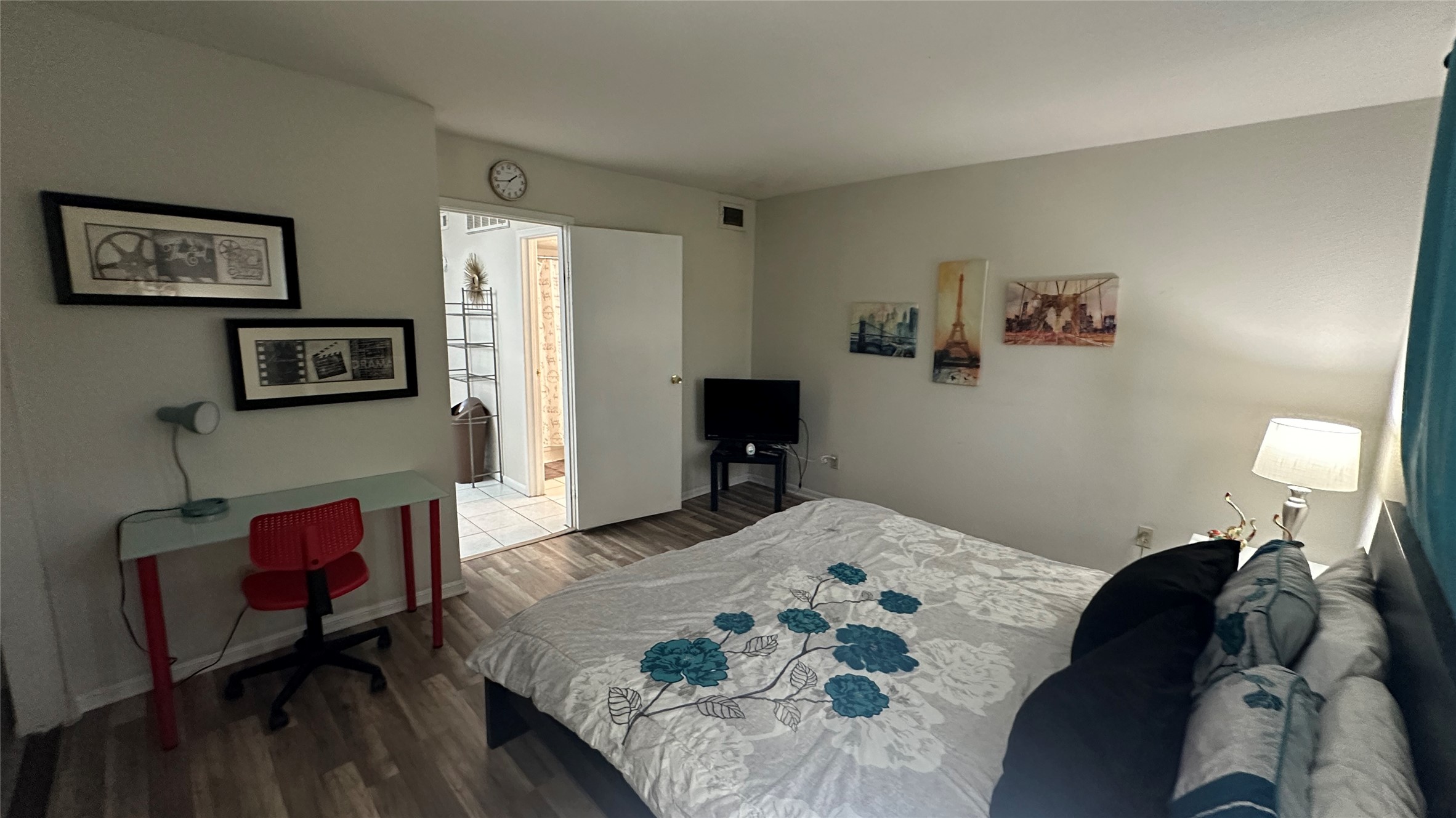 2425 Holly Hall Street, Unit 51C Houston, TX 77054 - Photo 7 of 10 a bedroom with a bed window and a chair