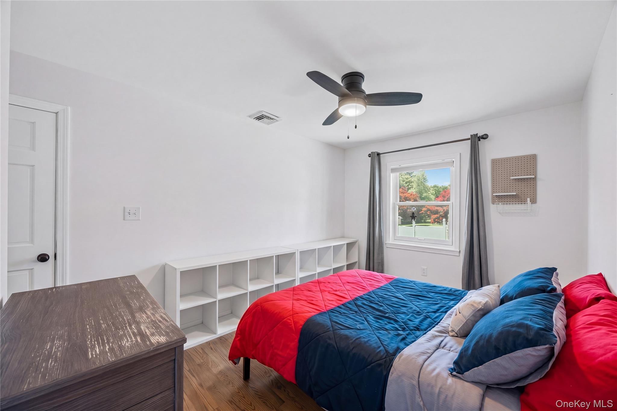 69 Silver Spring Road New Windsor, NY 12553 - Photo 18 of 20 a bedroom with a bed and a couch