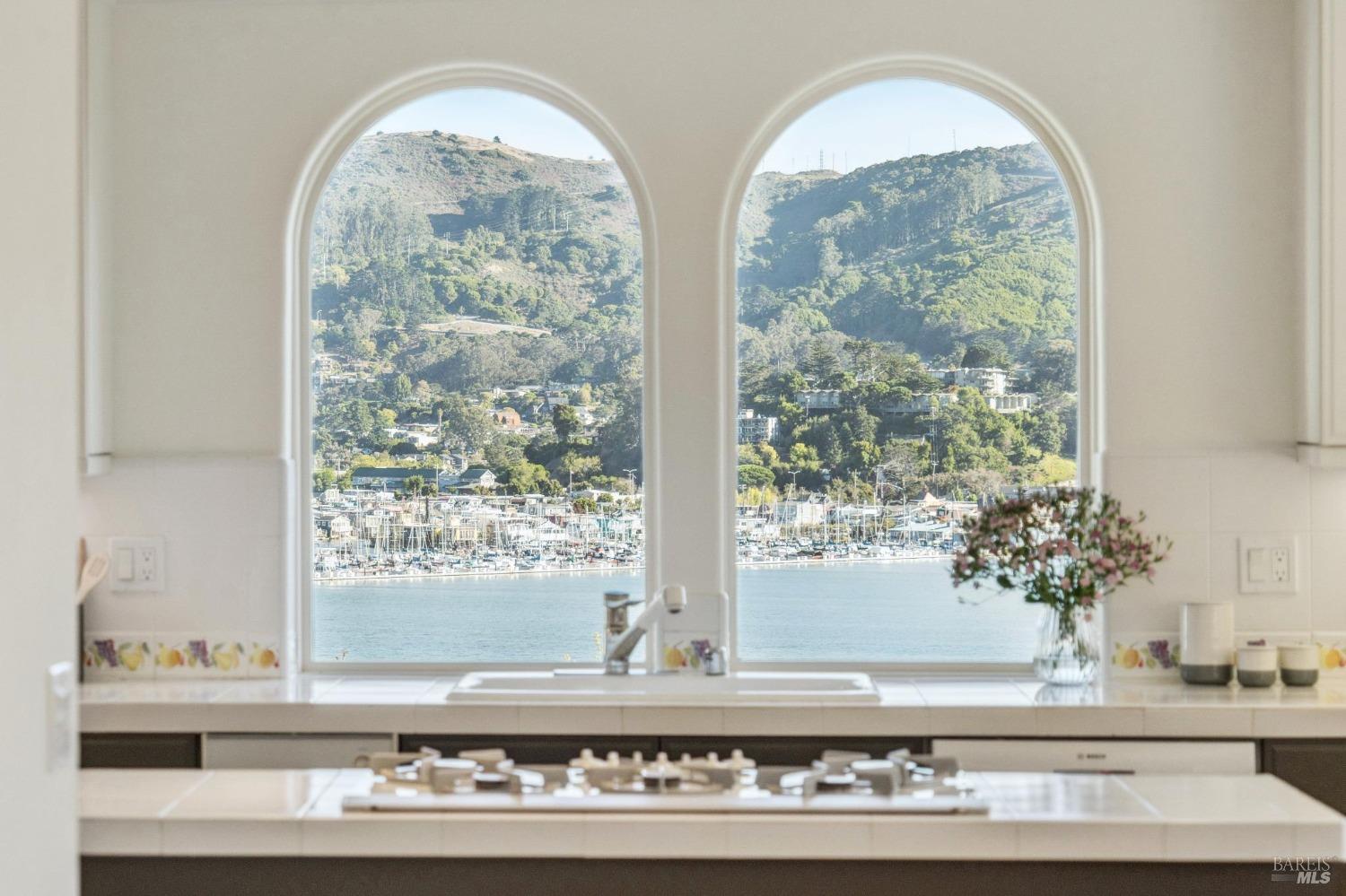 113 Chapel Drive Mill Valley, CA 94941 - Photo 20 of 60 a view of a living room with a large window and wooden floor