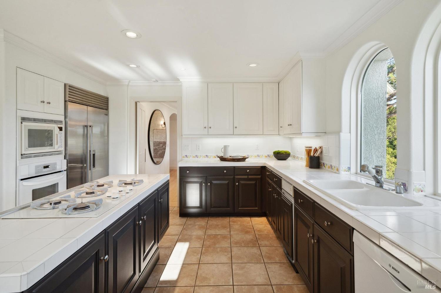 113 Chapel Drive Mill Valley, CA 94941 - Photo 21 of 60 a kitchen with stainless steel appliances granite countertop a sink stove and refrigerator