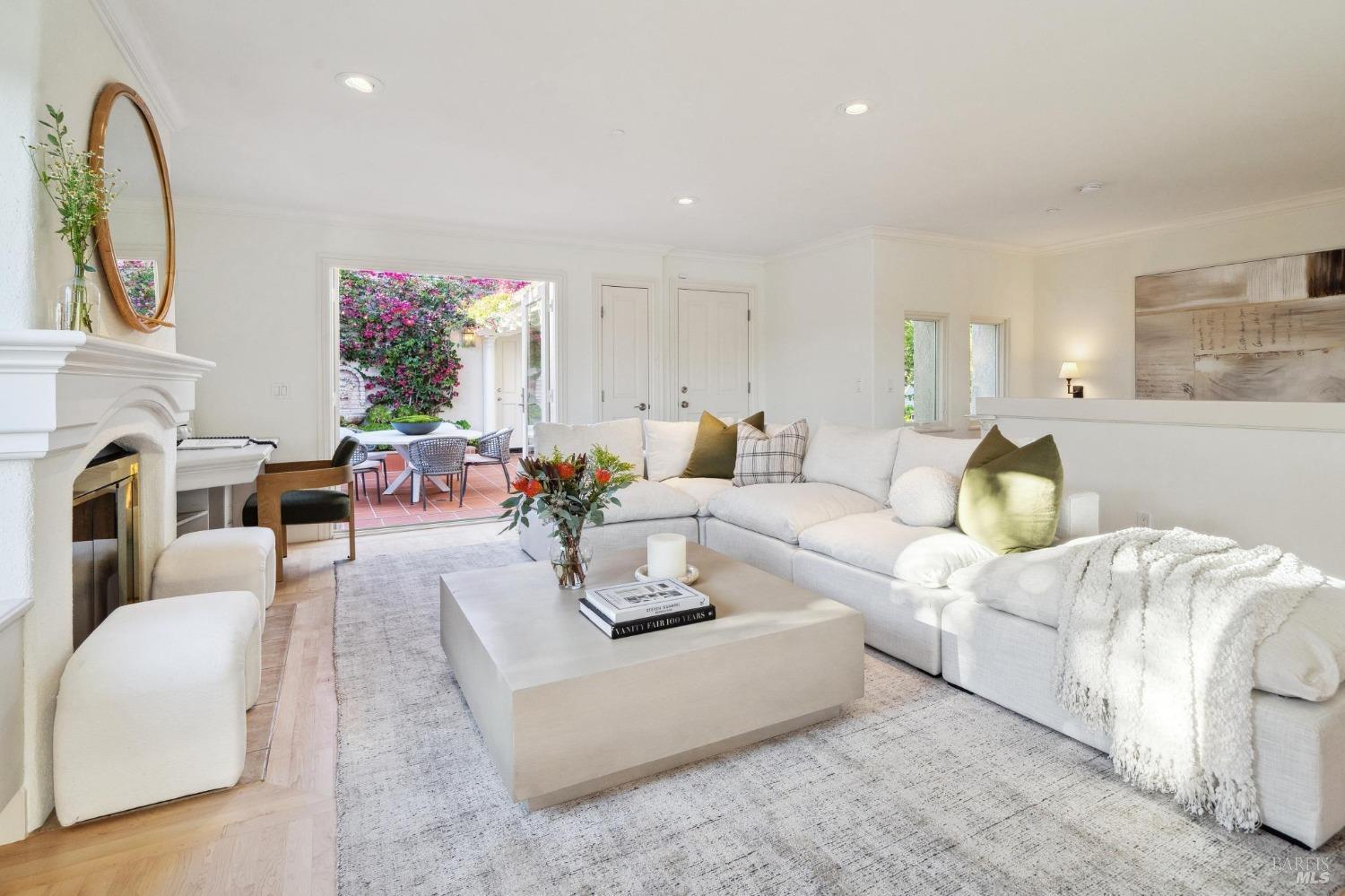 113 Chapel Drive Mill Valley, CA 94941 - Photo 26 of 60 a living room with furniture a mirror and a fireplace