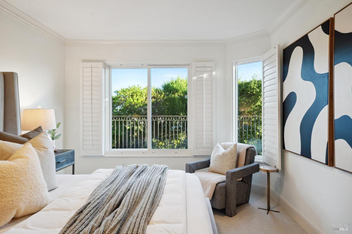 113 Chapel Drive Mill Valley, CA 94941 - Photo 47 of 60 a bedroom with a bed and a large window