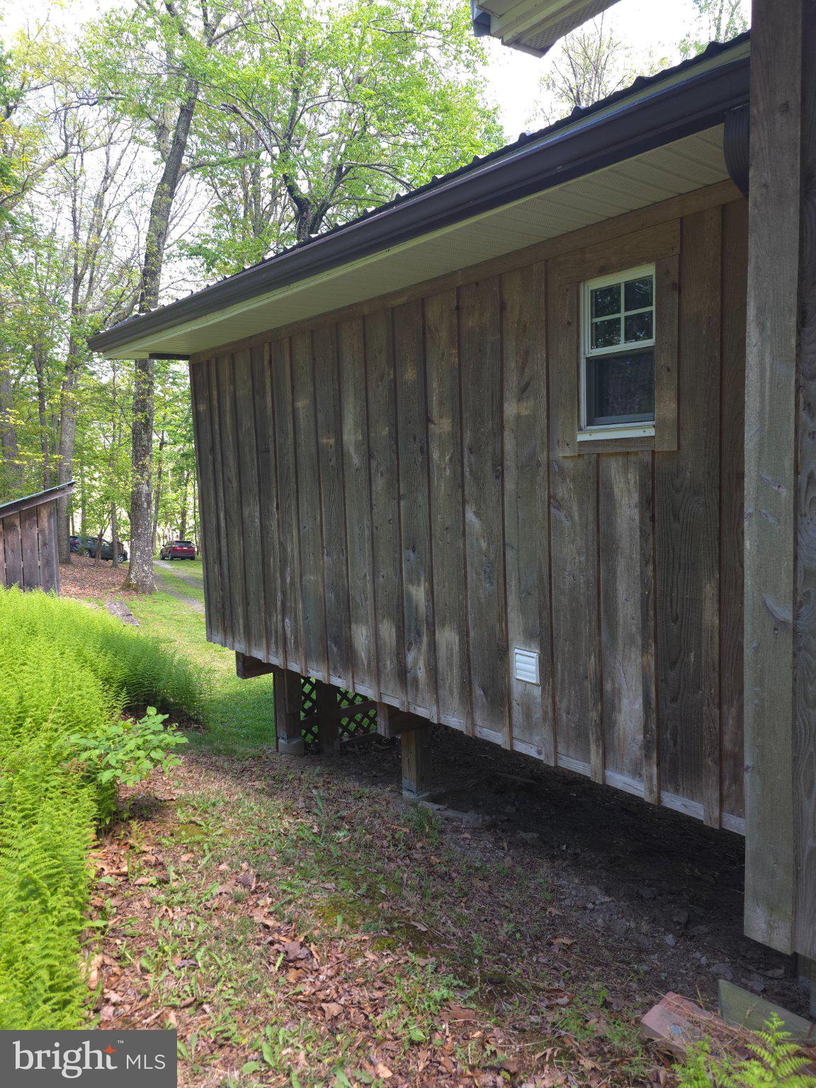 152 Sharp Ridge Lane Franklin, WV 26807 - Photo 45 of 53 a backyard of a house with lots of green space