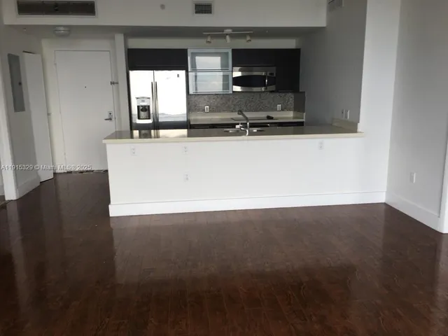 a view of kitchen and microwave