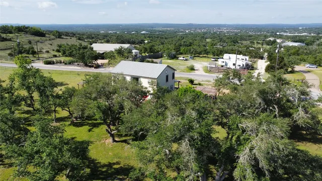 an aerial view of a house with porch