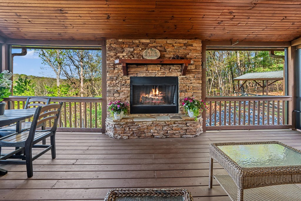 431 Sun Rock Mountain Road Blue Ridge, GA 30513 - Photo 8 of 57 a outdoor living space with a fireplace