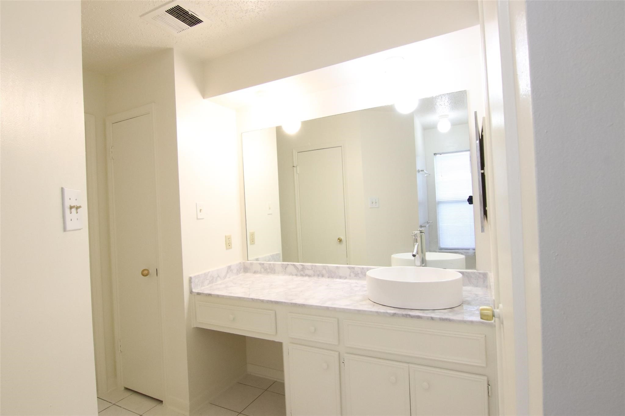 4231 Yupon Ridge Drive Houston, TX 77072 - Photo 11 of 18 a bathroom with a sink and a mirror