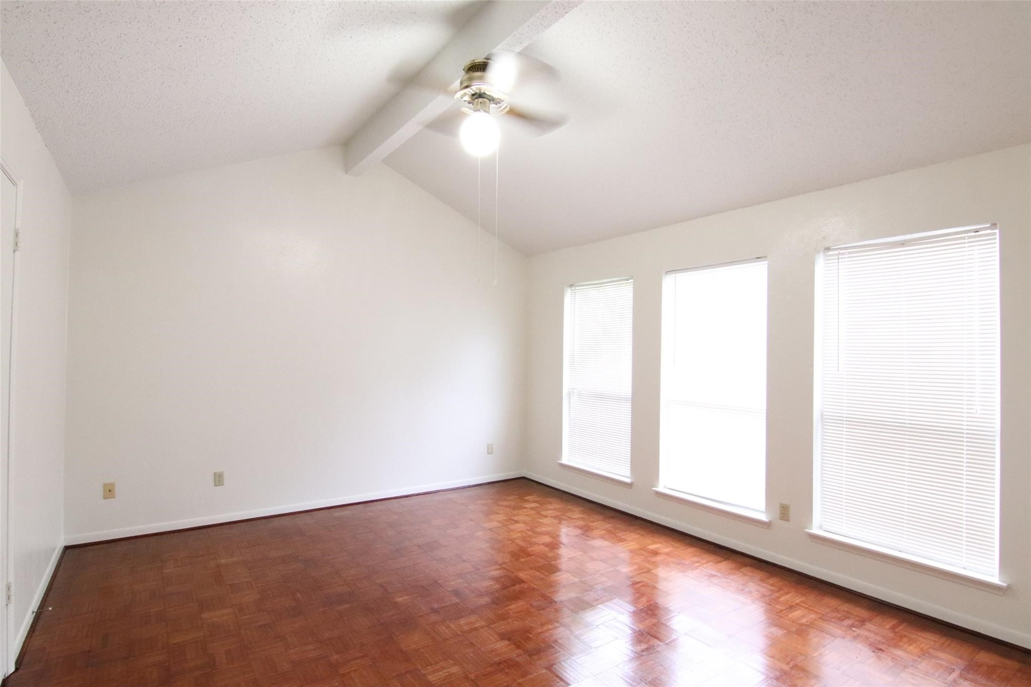 4231 Yupon Ridge Drive Houston, TX 77072 - Photo 10 of 18 wooden floor in an empty room with a window