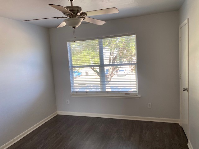 18911 Brownstone Mills Drive Cypress, TX 77433 - Photo 14 of 22 a view of an empty room with wooden floor and a window