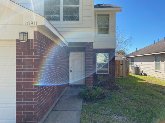 18911 Brownstone Mills Drive Cypress, TX 77433 - Photo 2 of 22 a view of house with backyard