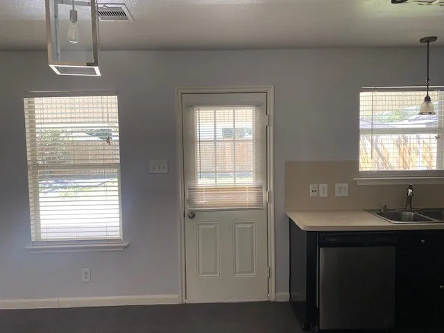 a bathroom with a sink a vanity and a tub