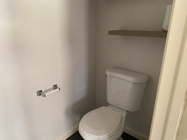 18911 Brownstone Mills Drive Cypress, TX 77433 - Photo 9 of 22 a white toilet sitting next to a white sink