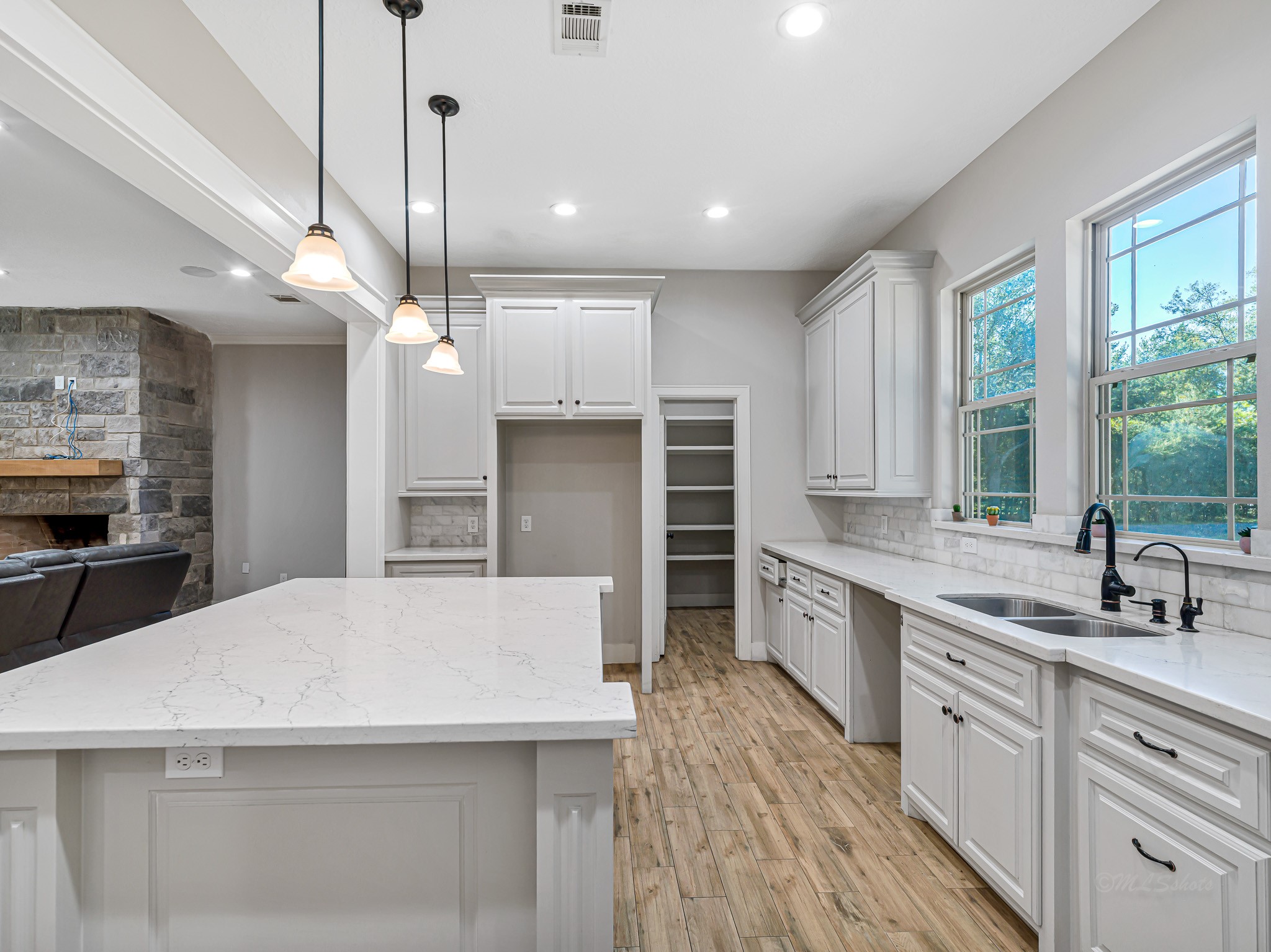 18117 FM 762 Road Needville, TX 77461 - Photo 11 of 37 a large kitchen with kitchen island a sink stainless steel appliances and cabinets