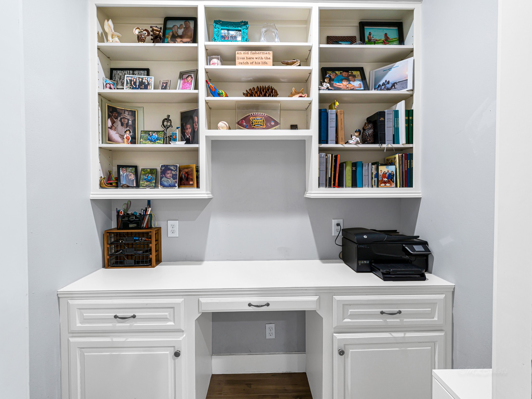 18117 FM 762 Road Needville, TX 77461 - Photo 15 of 37 a kitchen with white cabinets and a wooden floor