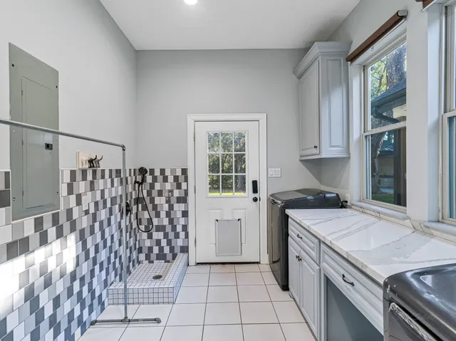 a kitchen with a stove a sink and a refrigerator
