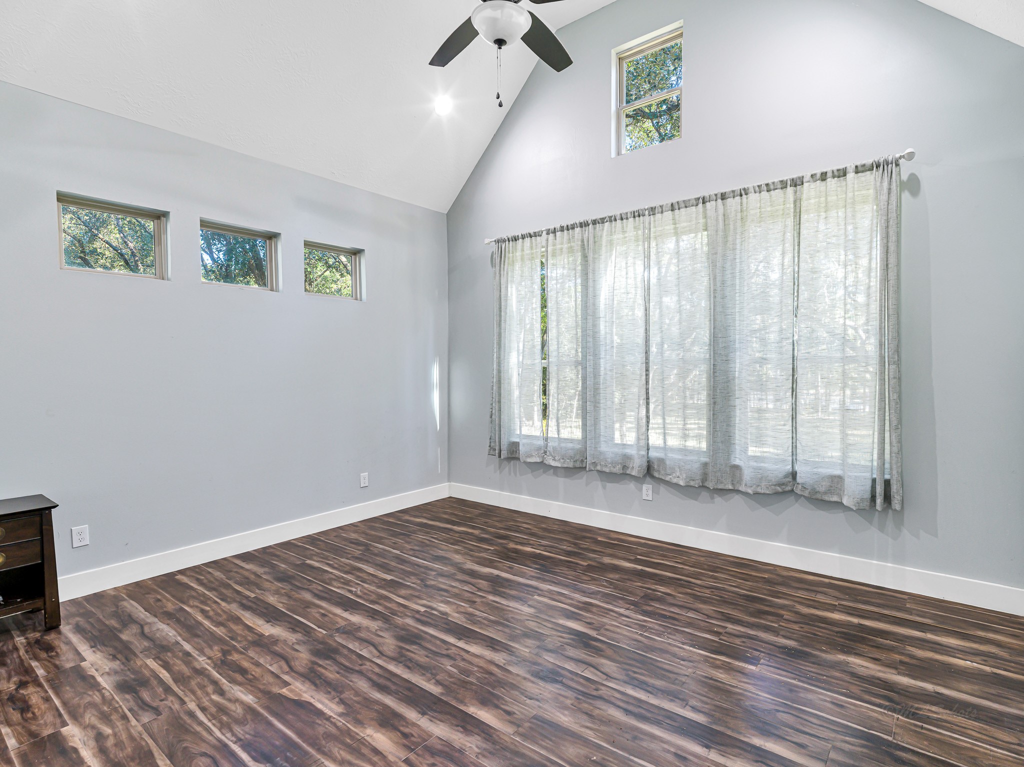 18117 FM 762 Road Needville, TX 77461 - Photo 20 of 37 a view of an empty room with wooden floor and a window