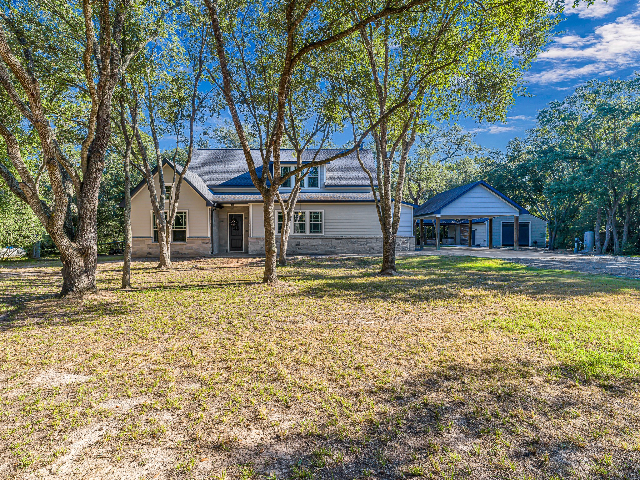 18117 FM 762 Road Needville, TX 77461 - Photo 2 of 37 a house with trees in front of it