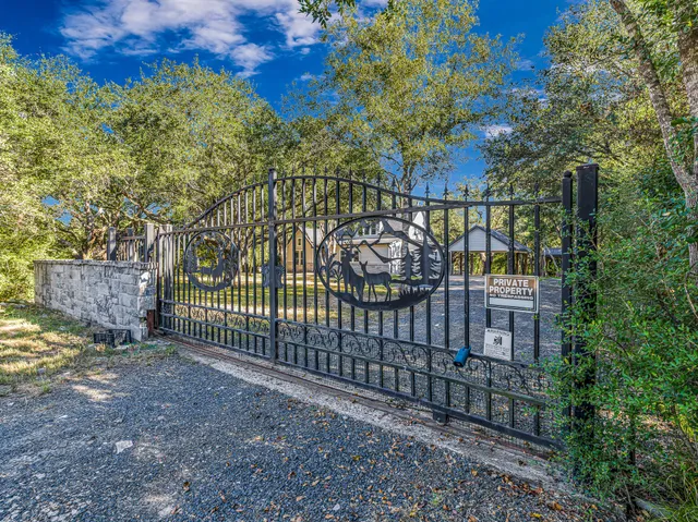a view of a wrought iron fences in front of house