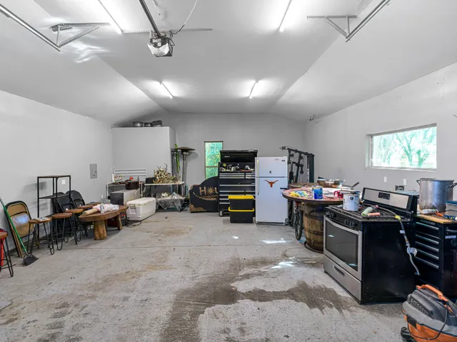 a front view of a house with a yard table and chairs