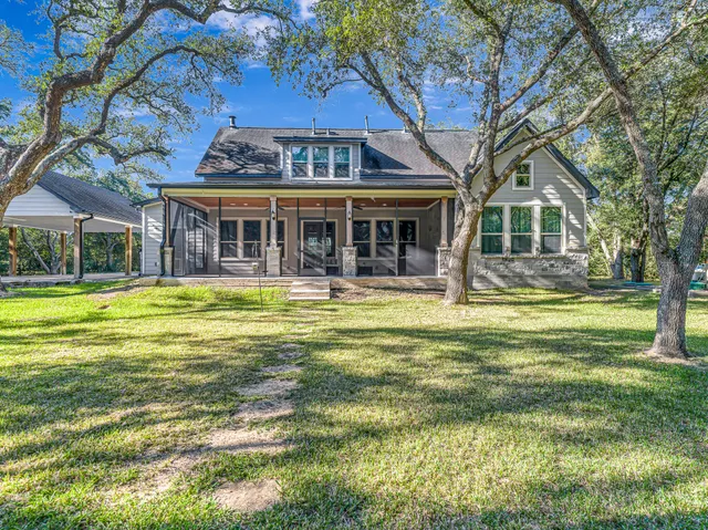 a backyard of a house with lots of green space
