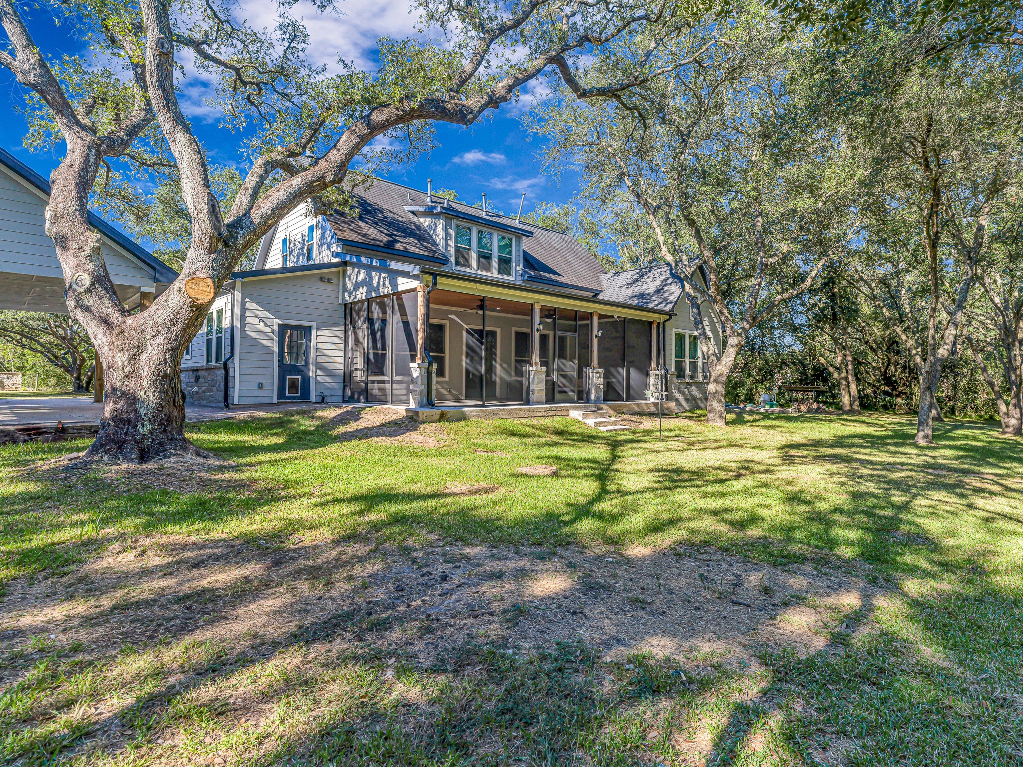 18117 FM 762 Road Needville, TX 77461 - Photo 34 of 37 a front view of a house with a yard table and chairs