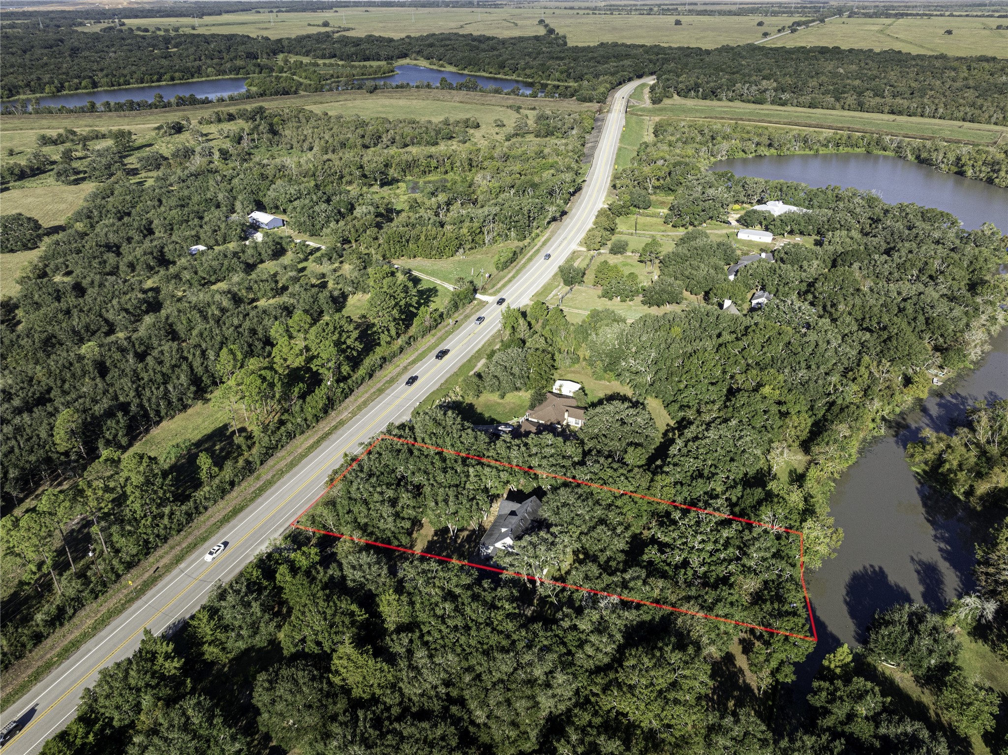18117 FM 762 Road Needville, TX 77461 - Photo 5 of 37 a view of a garden with a lake view